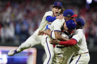 Philadelphia Phillies celebrate after winning the baseball NL Championship Series against the San Diego Padres on Sunday, Oct. 23, 2022, in Philadelphia. (AP Photo/Brynn Anderson)