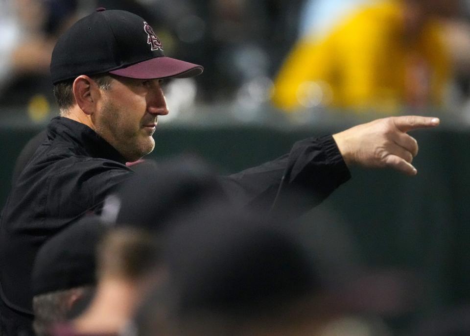 ASU Sun Devils head coach Willie Bloomquist signals to his team during a game as it takes on the Washington State Cougars on April 7, 2023, at Phoenix Municipal Stadium in Phoenix.