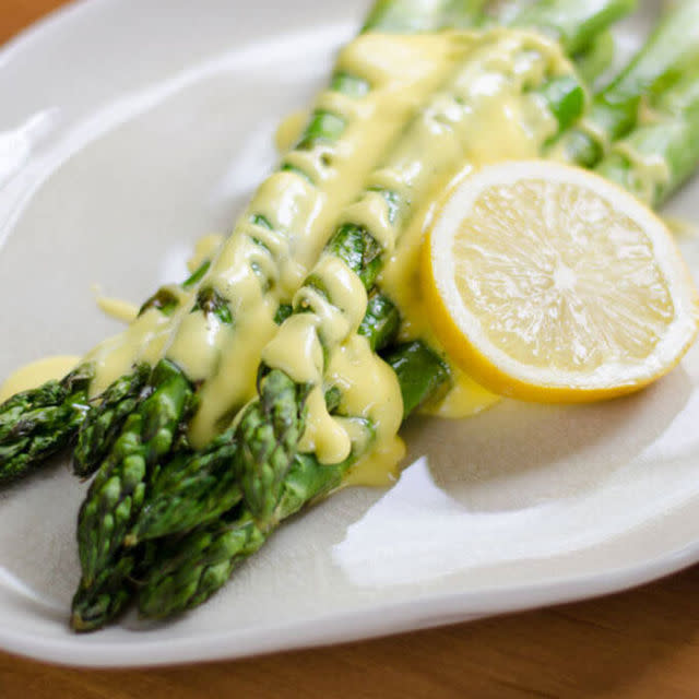 <p>If asparagus is a must for your big meal, you might as well top off the spears with a rich sauce you can whip up in seconds <a rel="nofollow noopener" href="http://www.redbookmag.com/food-recipes/entertaining/features/g2673/foods-you-can-make-in-your-blender/" target="_blank" data-ylk="slk:using a blender;elm:context_link;itc:0;sec:content-canvas" class="link ">using a blender</a>.</p><p><strong>Get the recipe at <a rel="nofollow noopener" href="http://cookeatpaleo.com/roasted-asparagus-with-easy-hollandaise-sauce/" target="_blank" data-ylk="slk:Cook Eat Paleo;elm:context_link;itc:0;sec:content-canvas" class="link ">Cook Eat Paleo</a>.</strong></p>