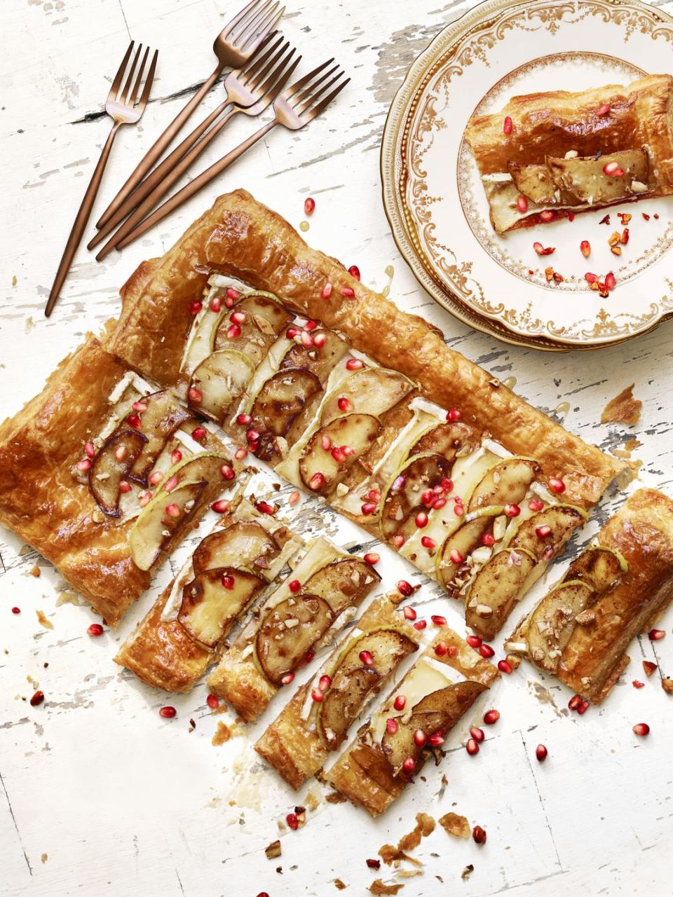 <p>Instead of tucking into a wheel of brie cheese, dress it up with apples and pomegranate seeds in this gorgeous tart. </p><p>Get the <a href="https://www.goodhousekeeping.com/food-recipes/a41395/best-brie-apple-tart/" rel="nofollow noopener" target="_blank" data-ylk="slk:Brie and Apple Tart recipe.;elm:context_link;itc:0;sec:content-canvas" class="link "><strong>Brie and Apple Tart recipe</strong>.</a><br></p><p><strong>RELATED: </strong><a href="https://www.goodhousekeeping.com/food-recipes/g3658/best-apple-recipes/" rel="nofollow noopener" target="_blank" data-ylk="slk:The 80 Tastiest Apple Recipes to Try for Fall;elm:context_link;itc:0;sec:content-canvas" class="link ">The 80 Tastiest Apple Recipes to Try for Fall</a></p>