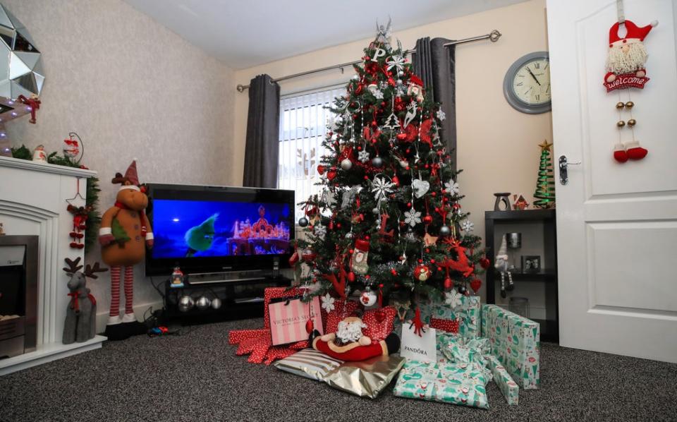 Christmas presents under tree (Peter Byrne/PA) (PA Archive)