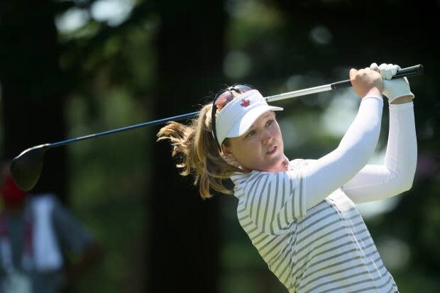 Canada's Brooke Henderson tees off at the 11th hole during the second round of the women's Olympic golf tournament.  (Mike Ehrmann/Getty Images - image credit)