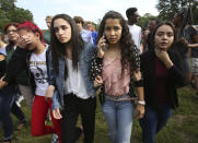 <p>Students are led out of Forest High School after a shooting at the school on Friday, April 20, 2018 in Ocala, Fla. (Photo: Bruce Ackerman/Star-Banner via AP) </p>