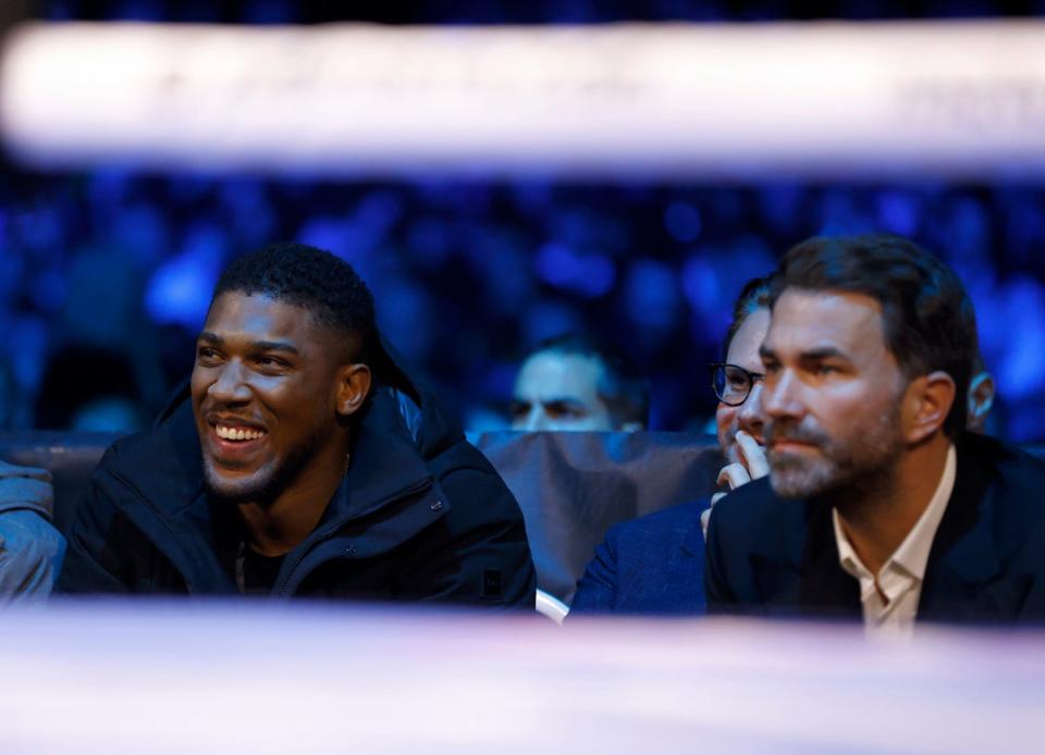 Anthony Joshua and Eddie Hearn in the stands at the OVO Arena Wembley, London (PA)
