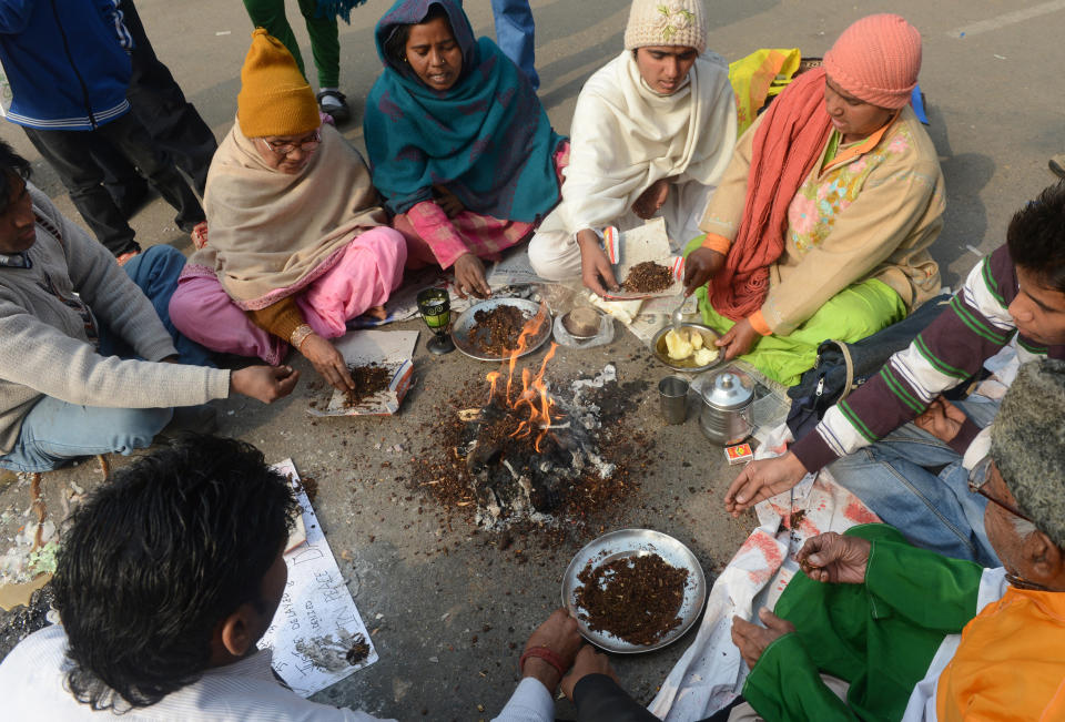 Indian demonstrators perform a prayer ritual in memory of a gang rape victim in New Delhi on December 31, 2012. (RAVEENDRAN/AFP/Getty Images)