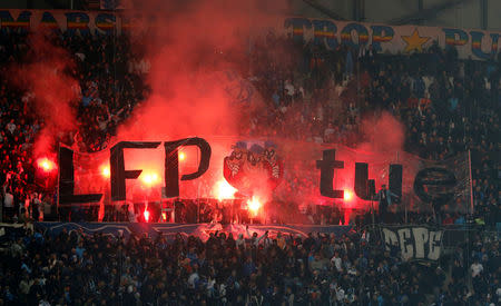 Soccer Football - Ligue 1 - Olympique de Marseille vs Bordeaux - Orange Velodrome, Marseille, France - February 18, 2018 Fans light flares REUTERS/Jean-Paul Pelissier