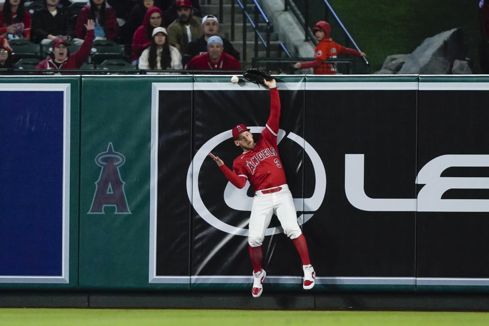Los Angeles Angels left fielder Taylor Ward can't catch the ball on a double by Minnesota Twins' Edouard Julien, during the seventh inning of a baseball game Saturday, April 27, 2024, in Anaheim, Calif. Two runs scored. (AP Photo/Ryan Sun)