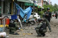 A Thai bomb squad inspects the site of an attack outside of a hotel in the southern province of Pattani on August 24, 2016