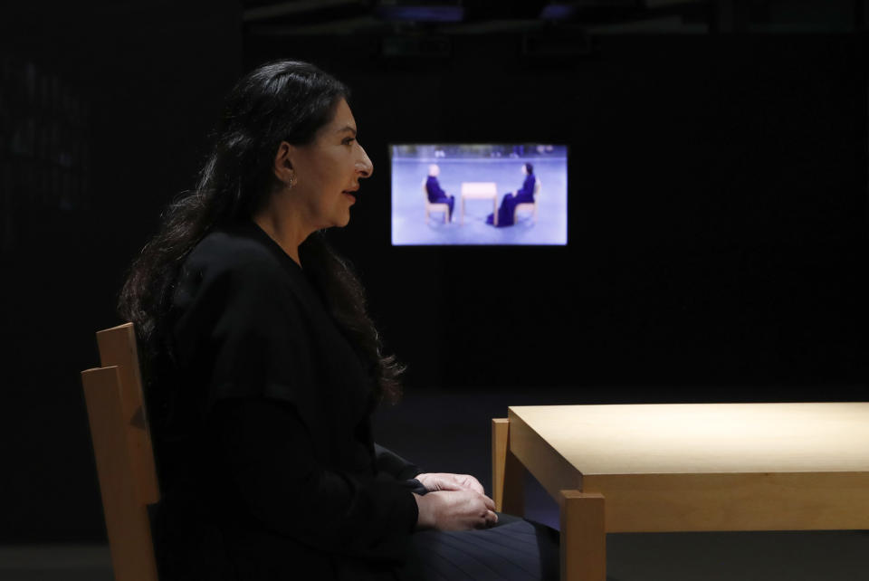 Performance artist Marina Abramovic performs during the art exhibition "Marina Abramovic - The Cleaner" in the Museum of Contemporary Art in Belgrade, Serbia, Saturday, Sept. 21, 2019. Abramovic is displaying her work in her native Belgrade for the first time in 44 years and she says that returning home has been highly emotional. (AP Photo/Darko Vojinovic)