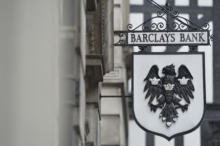 A logo hangs outside a branch of Barclays bank in London July 30, 2013. REUTERS/Toby Melville