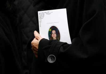 An Order of Service for the funeral of murdered student Meredith Kercher is seen at the Croydon Parish Church, south London, December 14, 2007. REUTERS/Kieran Doherty