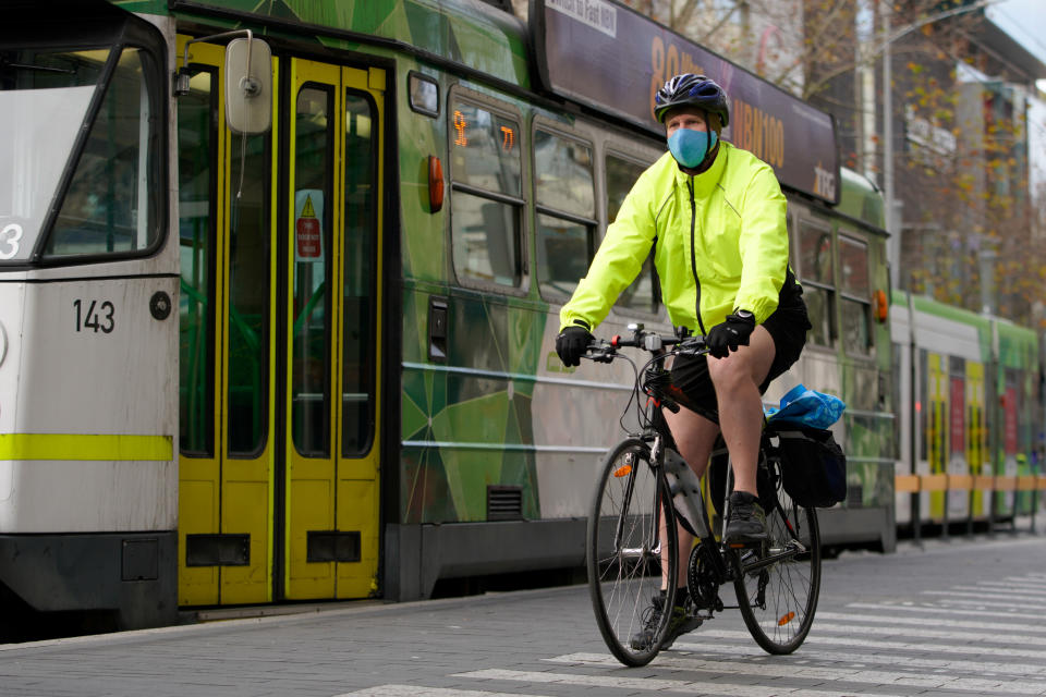 A cyclist wears a protective face mask in Melbourne.