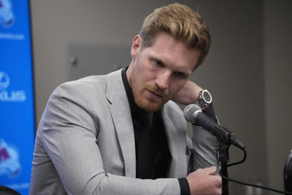 Injured Colorado Avalanche left wing and captain Gabriel Landeskog talks during a news conference Thursday, April 13, 2023, in Denver. Landeskog announced that he will not play in this year's Stanley Cup playoffs because of a lingering knee injury. (AP Photo/David Zalubowski