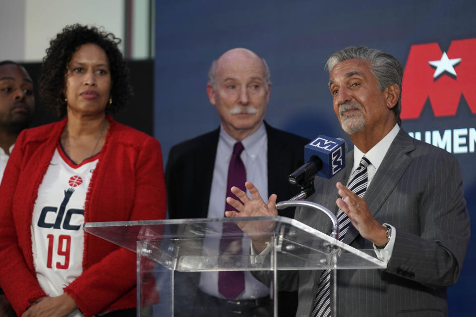 Ted Leonsis, right, owner of the Washington Wizards NBA basketball team and Washington Capitals NHL hockey team, speaks during a news conference with Washington DC Mayor Muriel Bowser, left, and DC Council Chairman Phil Mendelson, center, at Capitol One Arena in Washington, Wednesday, March 27, 2024. (AP Photo/Stephanie Scarbrough)
