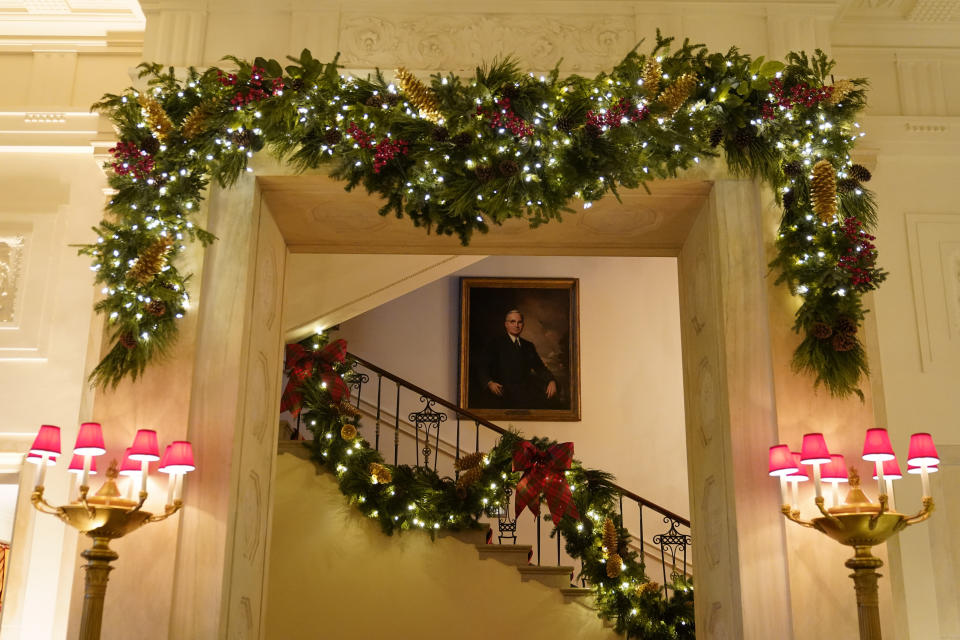The Grand Staircase of the White House is decorated during the 2020 Christmas preview, Monday, Nov. 30, 2020, in Washington. (AP Photo/Patrick Semansky)