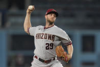 Arizona Diamondbacks starting pitcher Merrill Kelly works against a Los Angeles Dodgers batter during the first inning in Game 1 of a baseball NL Division Series Saturday, Oct. 7, 2023, in Los Angeles. (AP Photo/Ashley Landis)