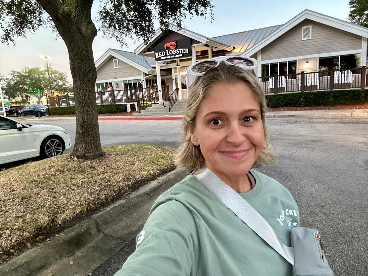 Author Terri Peters smiling outside of a Red Lobster location