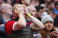 Disappointed Liverpool fans during the English Premier League soccer match between Liverpool and Crystal Palace at Anfield Stadium in Liverpool, England, Sunday, April 14, 2024. (AP Photo/Jon Super)
