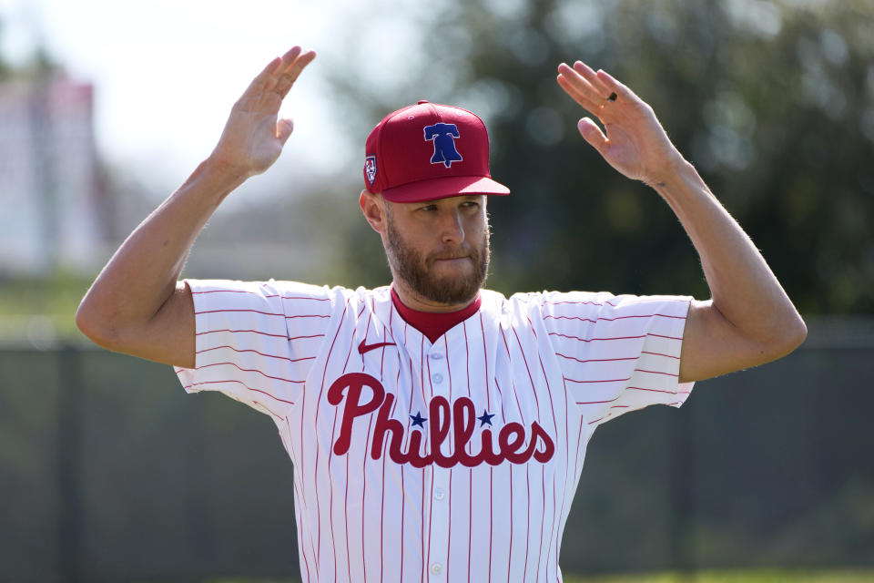 Philadelphia Phillies pitcher Zack Wheeler stretches during a baseball spring training workout Wednesday, Feb. 14, 2024, in Clearwater, Fla. (AP Photo/Charlie Neibergall)