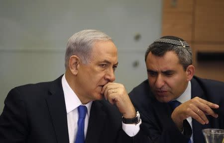 Israel's Prime Minister Benjamin Netanyahu (L) listens to Foreign Affairs and Defence committee chair Zeev Elkin during a committee meeting at parliament in Jerusalem June 2, 2014. REUTERS/Ronen Zvulun
