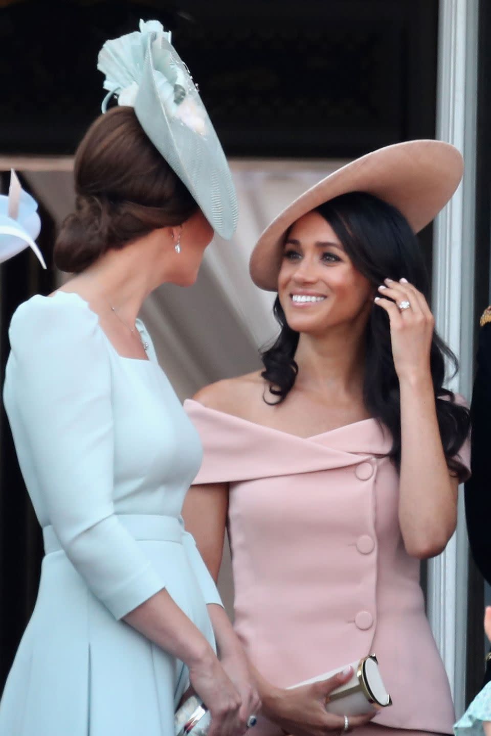 <p>Kate repeatedly turned around to speak with Meghan during the parade.</p>