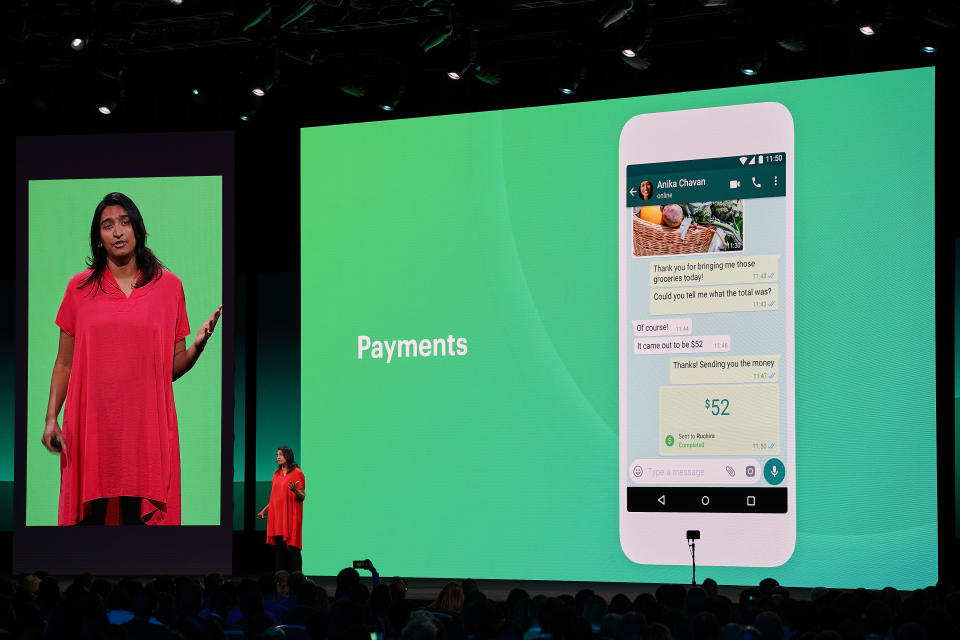 A woman presenting the payments feature on WhatsApp.