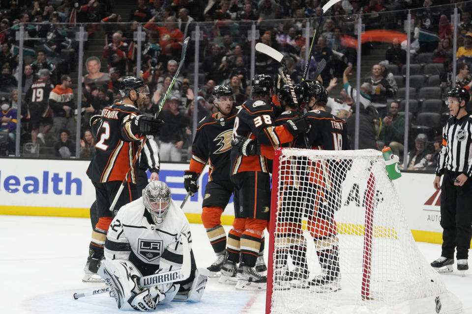 The Anaheim Ducks celebrate a goal by Adam Henrique during the second period of an NHL hockey game against the Los Angeles Kings on Tuesday, April 19, 2022, in Anaheim, Calif. (AP Photo/Marcio Jose Sanchez)