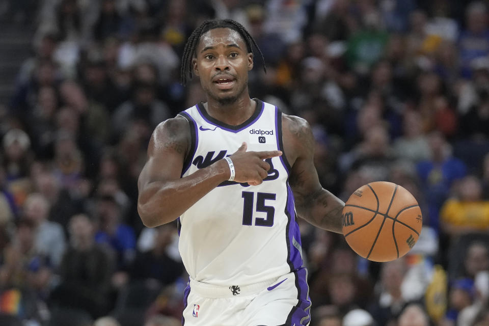 Sacramento Kings guard Davion Mitchell (15) brings the ball up the court against the Golden State Warriors during the first half of an NBA basketball game in San Francisco, Wednesday, Nov. 1, 2023. (AP Photo/Jeff Chiu)