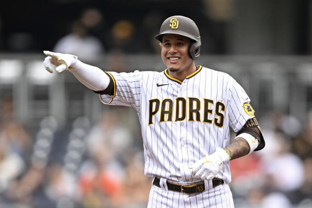 Manny Machado of the San Diego Padres speaks to Vladimir Guerrero Jr.  News Photo - Getty Images