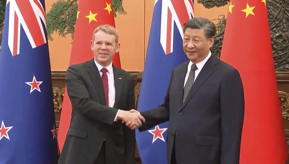 In this image made from video provided by TVNZ, New Zealand Prime Minister Chris Hipkins, left, shakes hands with Chinese President Xi Jinping before their meeting in Beijing, Tuesday, June 27, 2023. (TVNZ via AP)