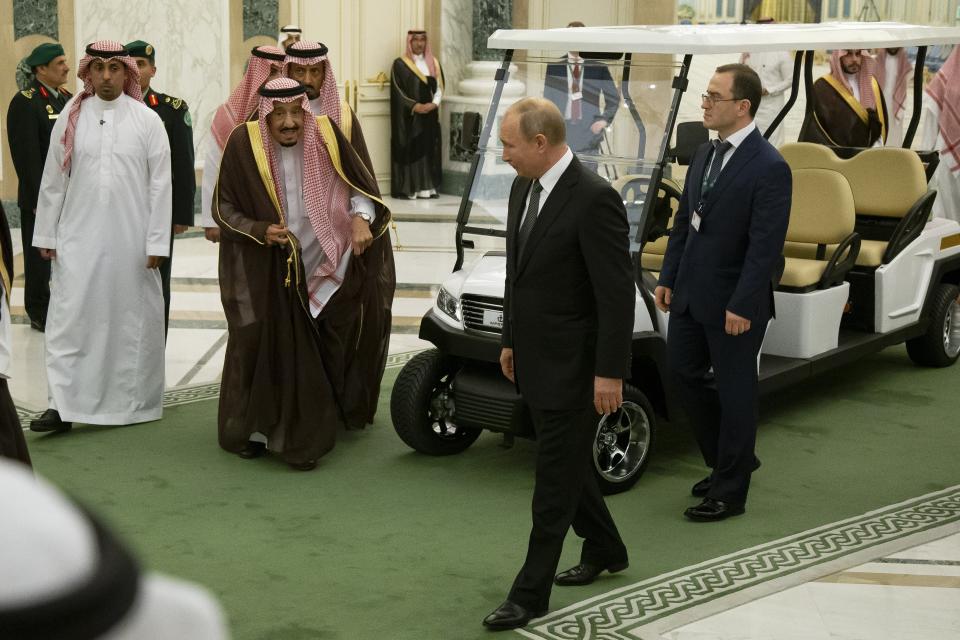 FILE - Russian President Vladimir Putin, center right, and Saudi Arabia's King Salman, center left, arrive for talks in Riyadh, Saudi Arabia, on Oct. 14, 2019. As part of its efforts to expand its global clout, Russia has moved to bolster ties with Saudi Arabia. (AP Photo/Alexander Zemlianichenko, Pool, File)