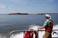 NASA videographer Jim Lucas watches onboard a US Coast Guard response boat as it passes Fort Sumter before a test launch of a balloon for the Space Grant Ballooning Project, at sea near Charleston, South Carolina, U.S. August 17, 2017. Location coordinates for this image are 32º41' 975" N 79º44'195" W. REUTERS/Randall Hill