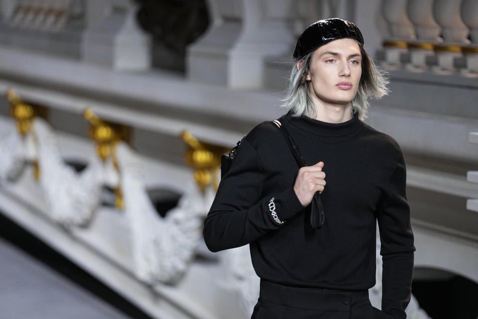 A model wears a creation for the Dior fall-winter 22/23 men's collection, in Paris, Friday, Jan. 21, 2022. (AP Photo/Michel Euler)