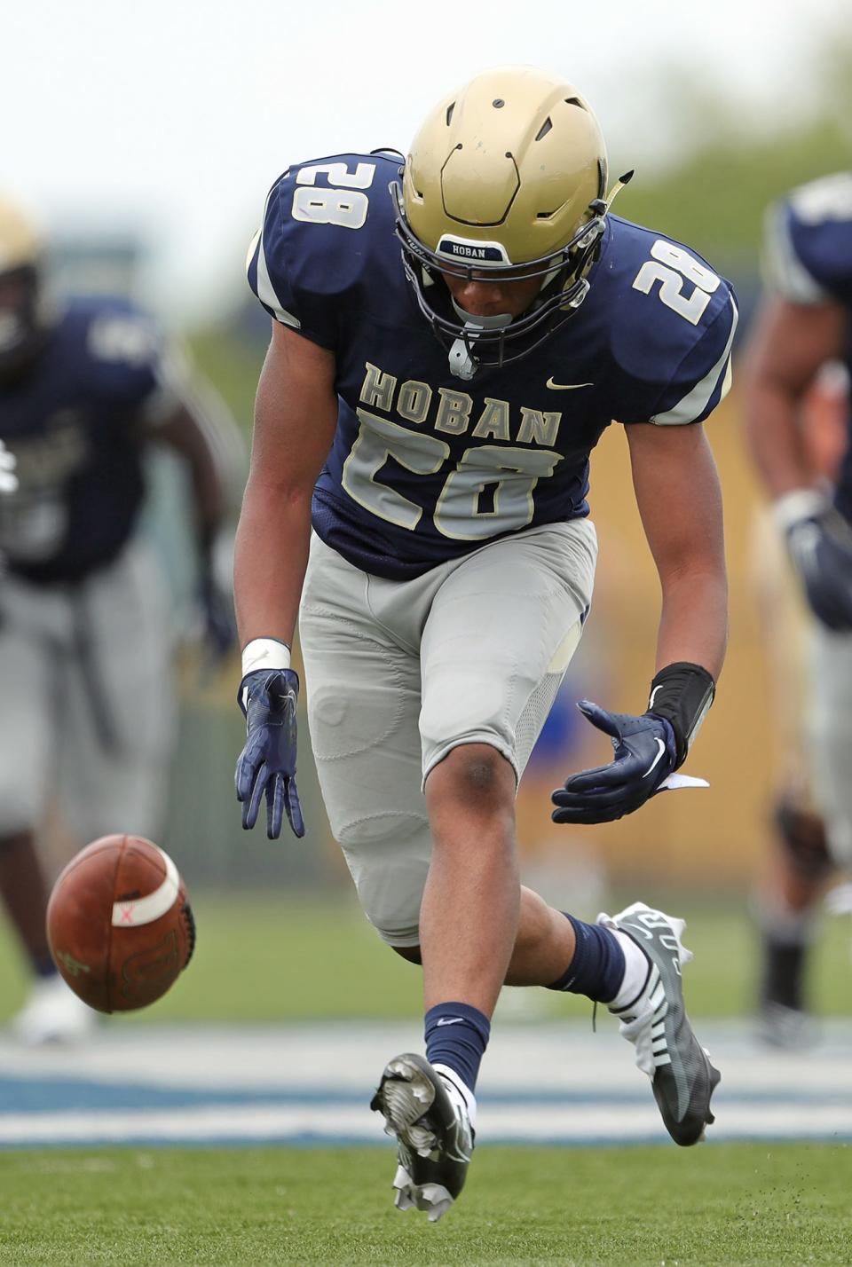 Hoban linebacker Cartier Williams scoops up an Iona Prep fumble and takes it all the way to score during the second half of a high school football game, Saturday, Sept. 3, 2022, in Akron, Ohio.