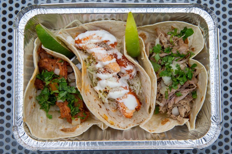 A Taco Trio at Estrella Azul: an al pastor taco (left to right), with marinated pork and pineapple; a Buffalo taco, with fried Buffalo chicken; and a carnitas taco, with shredded braised pork.