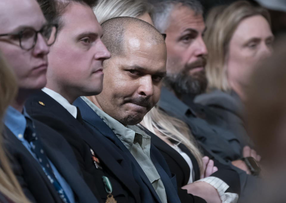 U.S. Capitol Police Sgt. Aquilino Gonell, center, sits with other officers who defended the Capitol during the Jan. 6 attack, as the House select committee investigating the insurrection holds a hearing at the Capitol in Washington, Tuesday, July 12, 2022. Gonell wept as committee member Rep. Jamie Raskin, D-Md., said his injuries would end his career as an officer. (AP Photo/J. Scott Applewhite)