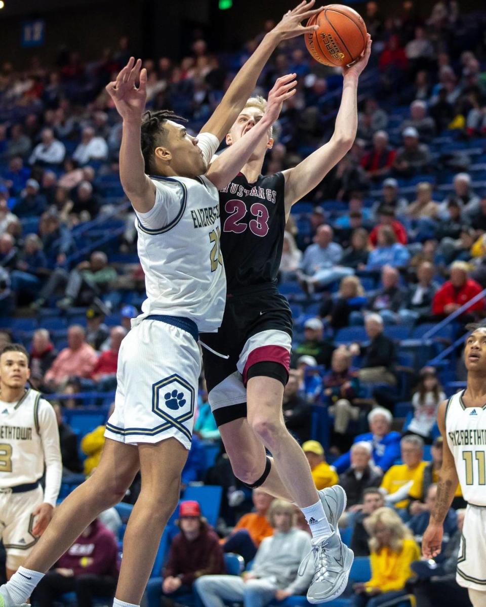 Elizabethtown’s Ayden Evans, who blocked seven shots in Wednesday’s win, contests a shot by McCracken County’s Ian Hart.