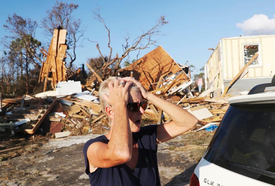 Becky Daniel reacts to seeing her Beacon Hill home next to Mexico City, Fla on October 11, 2018. The area was ground zero for Hurricane Michael.