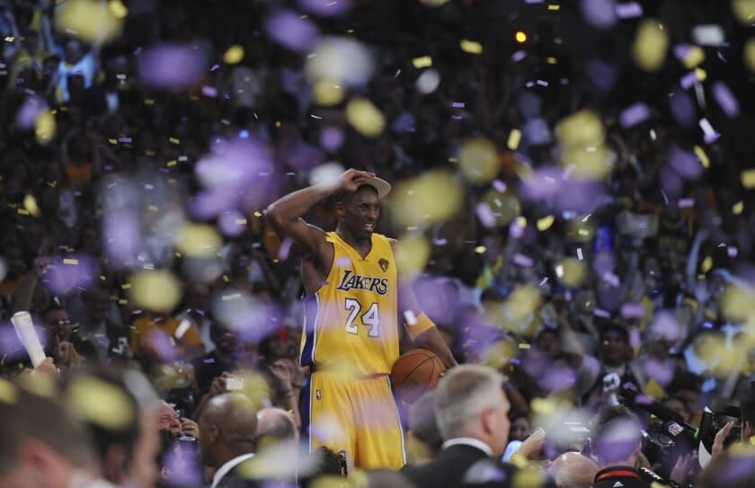 LOS ANGELES, CA – JUNE17, 2010 ––Kobe Bryant stands on the scorers table after Lakers defeated the Celtics.