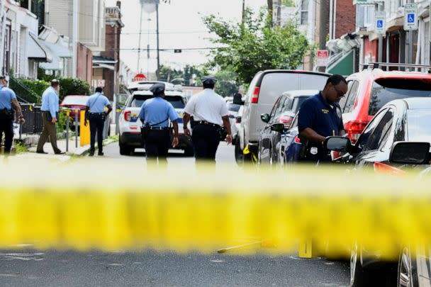 PHOTO: Police officers work at the scene as investigations are ongoing the day after a mass shooting in the Kingsessing section of southwest Philadelphia, July 4, 2023. (Bastiaan Slabbers/Reuters)