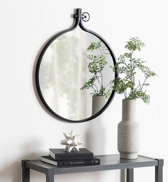 This piece has an embroidery hoop-turned-mirror vibe that's ~sew~ cool you're gonna want it hanging around your place forever!<br /><br /><strong>Promising review:</strong> "I purchased two of these mirrors for a recent master bathroom remodel. <strong>They are perfect! The color of the metal is really pretty, and they have the right amount of a rustic look.</strong> They were easy to hang and fit really nicely over each sink of the double sink vanity. The price was great as I had seen others that looked similar but were more expensive." &mdash; <a href="https://www.amazon.com/gp/customer-reviews/R2IQ3AGI95P19Z?&amp;linkCode=ll2&amp;tag=huffpost-bfsyndication-20&amp;linkId=eeb45ff441478850aa12926153212af2&amp;language=en_US&amp;ref_=as_li_ss_tl" target="_blank" rel="nofollow noopener noreferrer" data-skimlinks-tracking="5854435" data-vars-affiliate="Amazon" data-vars-href="https://www.amazon.com/gp/customer-reviews/R2IQ3AGI95P19Z?tag=bfmal-20&amp;ascsubtag=5854435%2C3%2C37%2Cmobile_web%2C0%2C0%2C16324241" data-vars-keywords="cleaning" data-vars-link-id="16324241" data-vars-price="" data-vars-product-id="20942657" data-vars-product-img="" data-vars-product-title="" data-vars-retailers="Amazon">Darcy Deloach</a><br /><br /><strong>Get it from Amazon for <a href="https://www.amazon.com/Kate-Laurel-Industrial-Rustic-Diameter/dp/B07B4JPV9X?&amp;linkCode=ll1&amp;tag=huffpost-bfsyndication-20&amp;linkId=9603f9e50423cfdf0db7a1977d9e9652&amp;language=en_US&amp;ref_=as_li_ss_tl" target="_blank" rel="nofollow noopener noreferrer" data-skimlinks-tracking="5854435" data-vars-affiliate="Amazon" data-vars-asin="B07NLD1V2F" data-vars-href="https://www.amazon.com/dp/B07NLD1V2F?tag=bfmal-20&amp;ascsubtag=5854435%2C3%2C37%2Cmobile_web%2C0%2C0%2C16323397" data-vars-keywords="cleaning" data-vars-link-id="16323397" data-vars-price="" data-vars-product-id="19067482" data-vars-product-img="https://m.media-amazon.com/images/I/31snmsaF-fL.jpg" data-vars-product-title="Kate and Laurel Yitro Round Industrial Modern Metal Framed Wall Mirror, 23.5x28.5, Black" data-vars-retailers="Amazon">$73.16+</a> (available in two sizes and six colors).</strong>