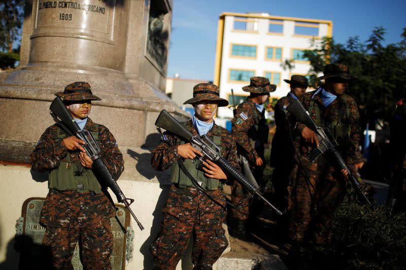 Salvadoran soldiers gather before a ceremony to deploy military personnel to support a security plan in San Salvador