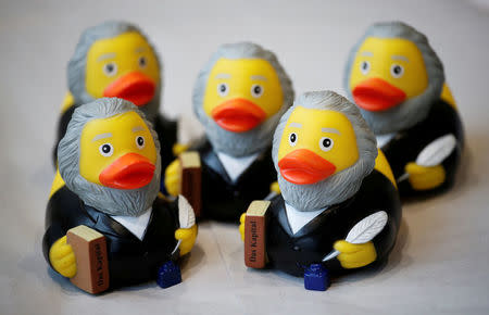 FILE PHOTO: Rubber ducks depicting German philosopher Karl Marx are for sale at the price of 5.90 euro (about 7.30 U.S. dollars) at a souvenir shop in his hometown in Trier, Germany, April 13, 2018. REUTERS/Wolfgang Rattay/File Photo