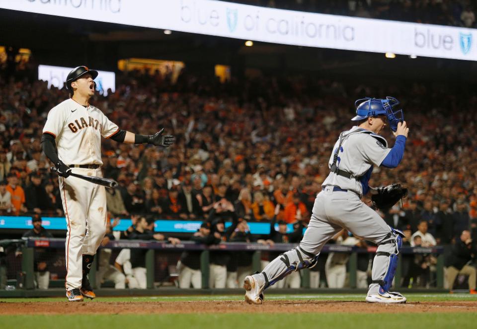 Giants first baseman Wilmer Flores reacts after being called out on strikes in the ninth inning.