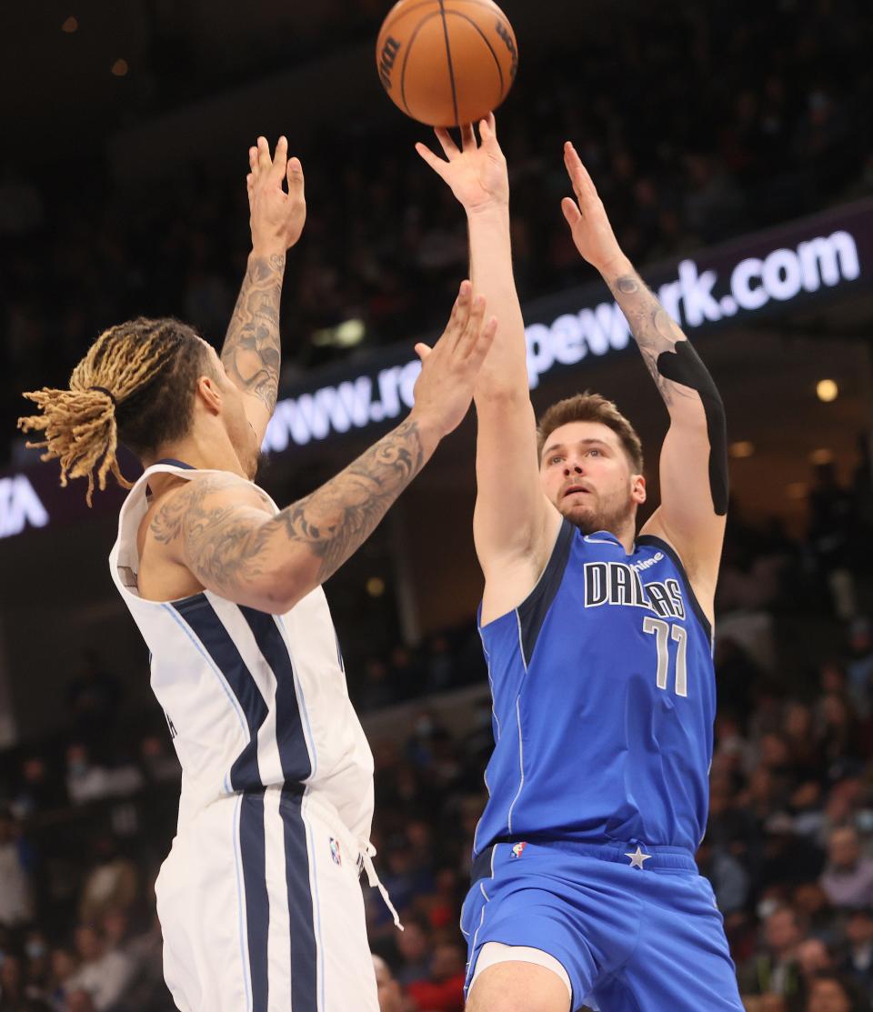 Dallas Mavericks guard Luka Doncic shoots the ball over Memphis Grizzlies forward Brandon Clarke at FedexForum on Friday, Jan. 14, 2022.  