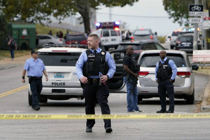 Law enforcement officials are pictured at the scene of a shooting at Central Visual and Performing Arts High School in St. Louis on Oct. 24, 2022.