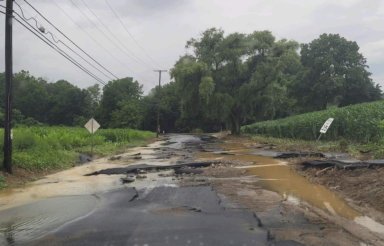 This photo provided by Jersey Central Power & Light shows flooding along Snyder Road, in Phillipsburg, N.J., near the intersection with county Route 519, Sunday, July 16, 2023. (Courtesy of JCP&L via AP)