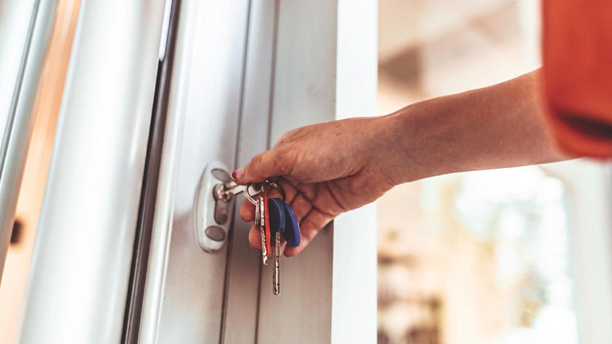 Woman opening the front door