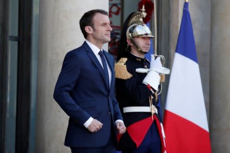 FILE PHOTO - French President Emmanuel Macron waits for the arrival of Senegalese President Macky Sall at the Elysee Palace in Paris, France, April 20, 2018. REUTERS/Benoit Tessier