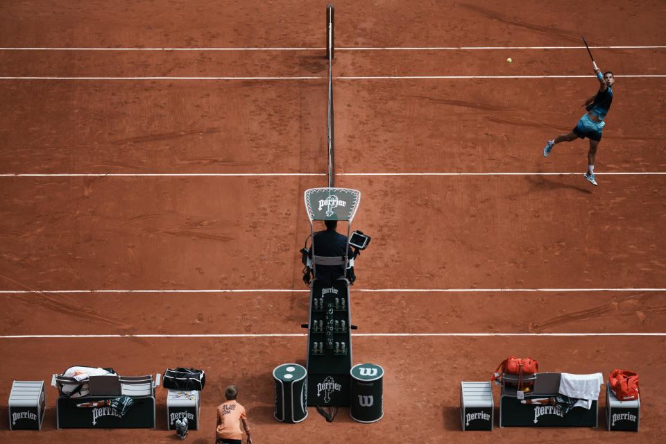 Serbia's Laslo Djere plays a shot against Russia's Daniil Medvedev during their second round match at the French Open tennis tournament in Roland Garros stadium in Paris, France, Thursday, May 26, 2022. (AP Photo/Thibault Camus)